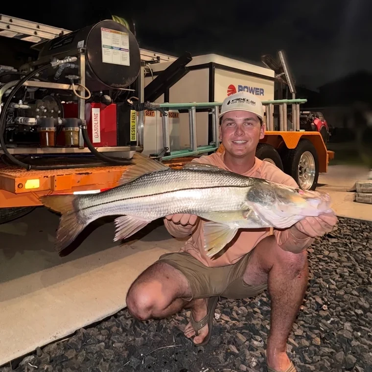 Eric Kuhn, owner of Xtreme Kleen, holding a snook on the Texas coast